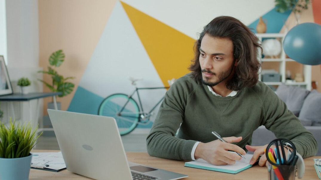 person working on laptop at home
