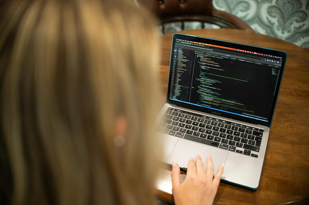 beginner typing code on laptop
