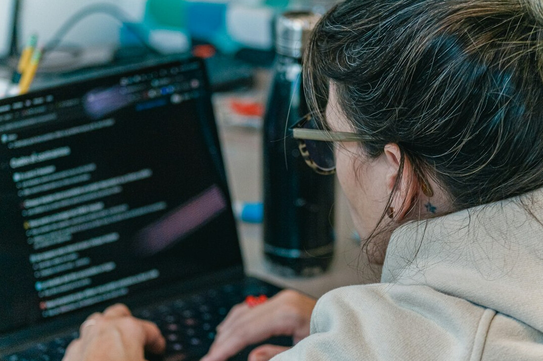 student working on coding project
