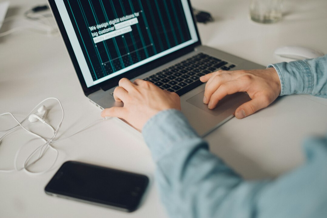 person learning programming on laptop