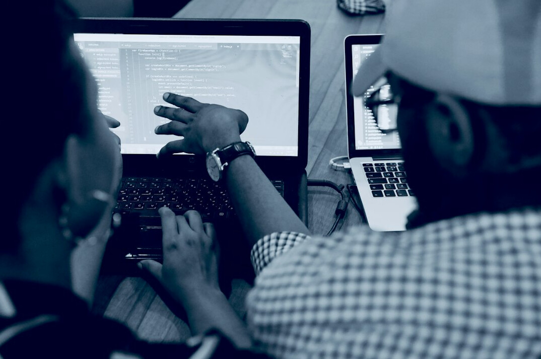 group of people coding together