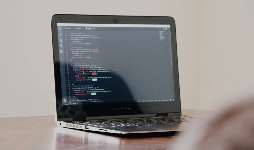 beginner coding on laptop