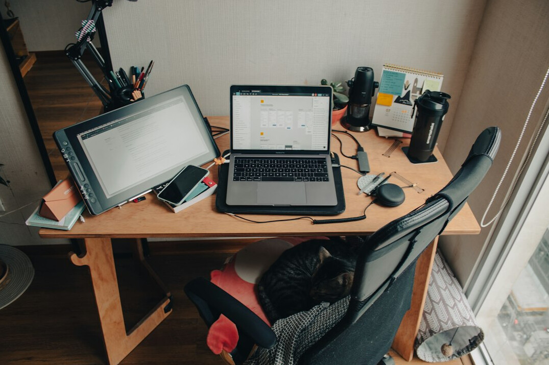 person coding at home desk
